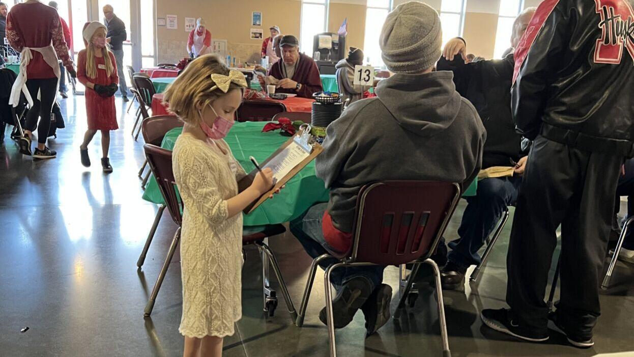 Volunteers serve Christmas Eve brunch at Omaha's Open Door Mission
